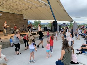 Crowd of people attending a concert at the Grant Amphitheater in Clement Park