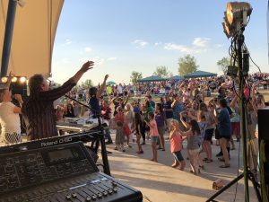 Crowd of people attending a concert at the Grant Amphitheater in Clement Park