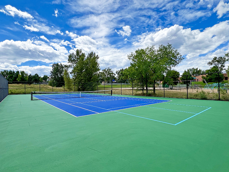 Resurfaced tennis court with pickleball lines painted on for multi-use.