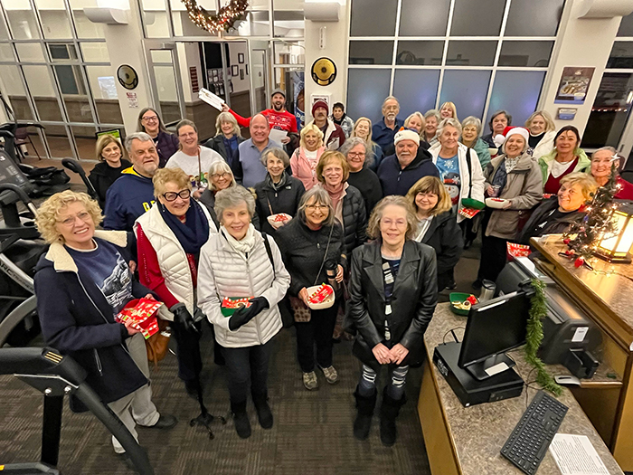 A large group of adults posing together for a picture.