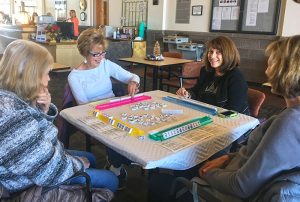 A group of ladies playing Mahjongg.