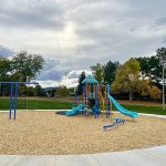 Playground equipment with swings, slides and climbing.