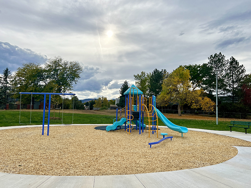 Playground equipment with swings, slides and climbing.